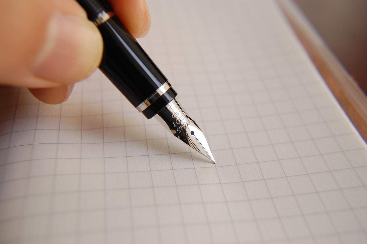 A fountain pen signing a formal document representing a negotiated agreement.