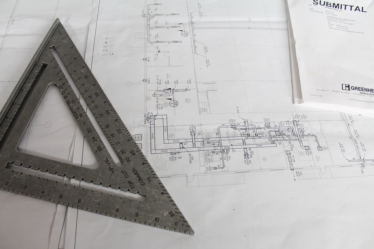 A detailed technical blueprint showing the foundation of a structure with professional tools.