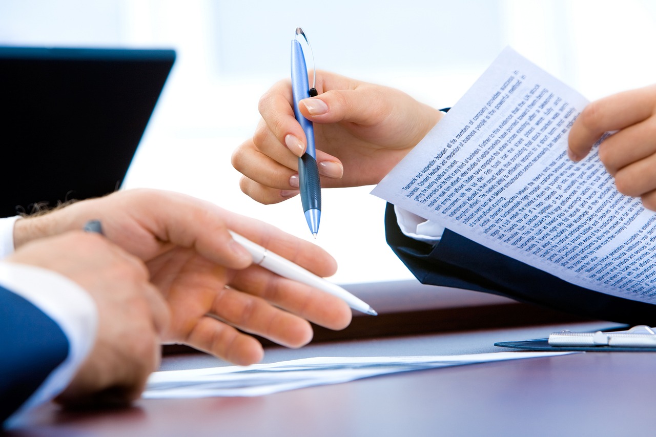 Close up of a luxury pen on a financial legal document representing tax-efficient planning.