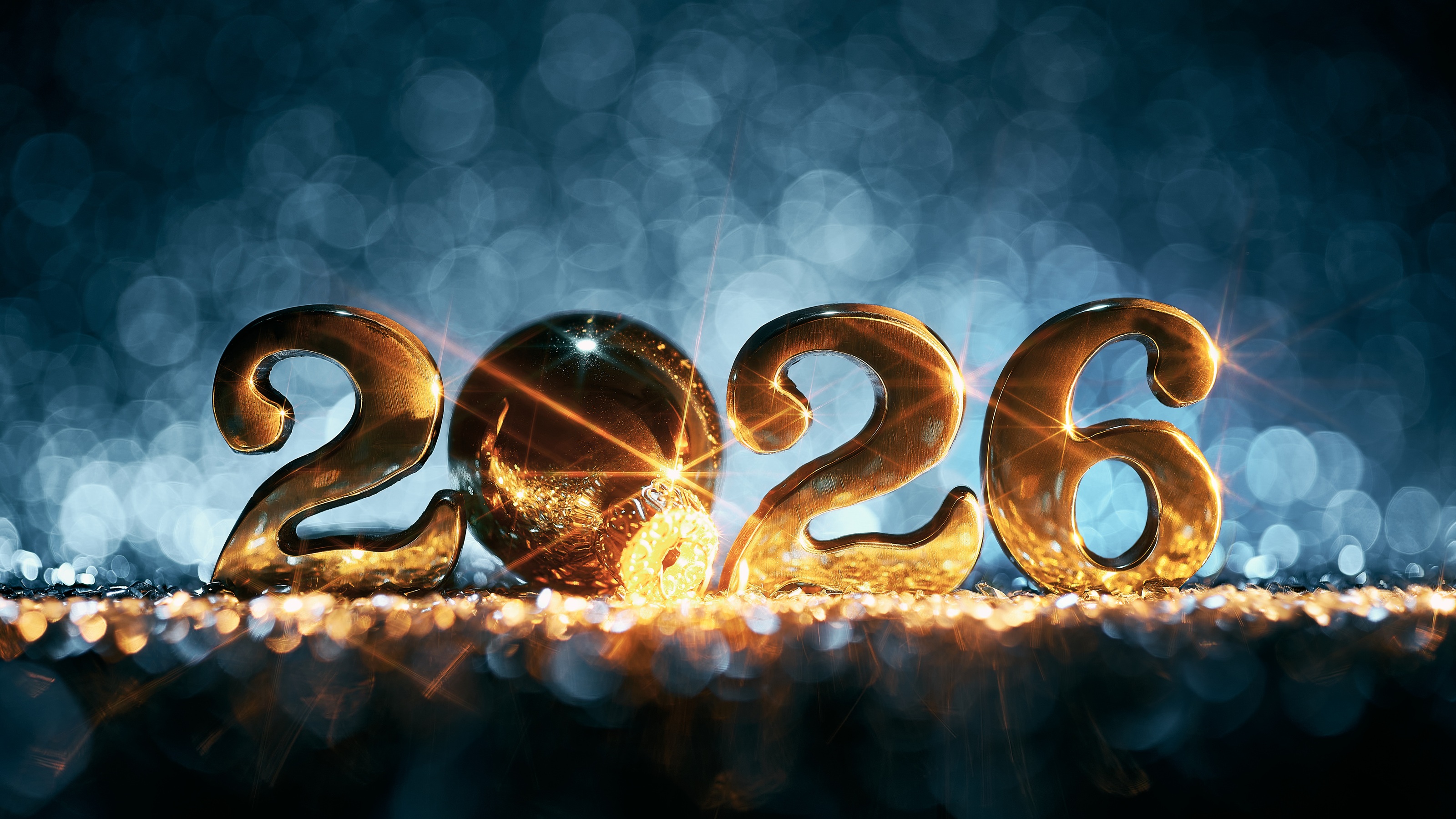 Symbolic gold numbers for the year 2026 against a professional blue background.