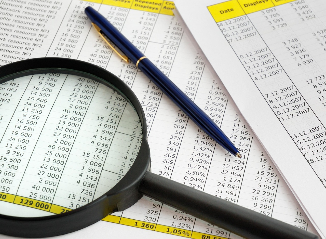 A magnifying glass hovering over legal text to symbolize detailed evidentiary review.