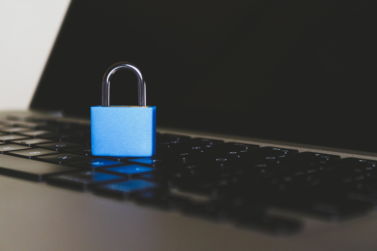 A laptop screen showing a security padlock icon to represent data privacy and protection.