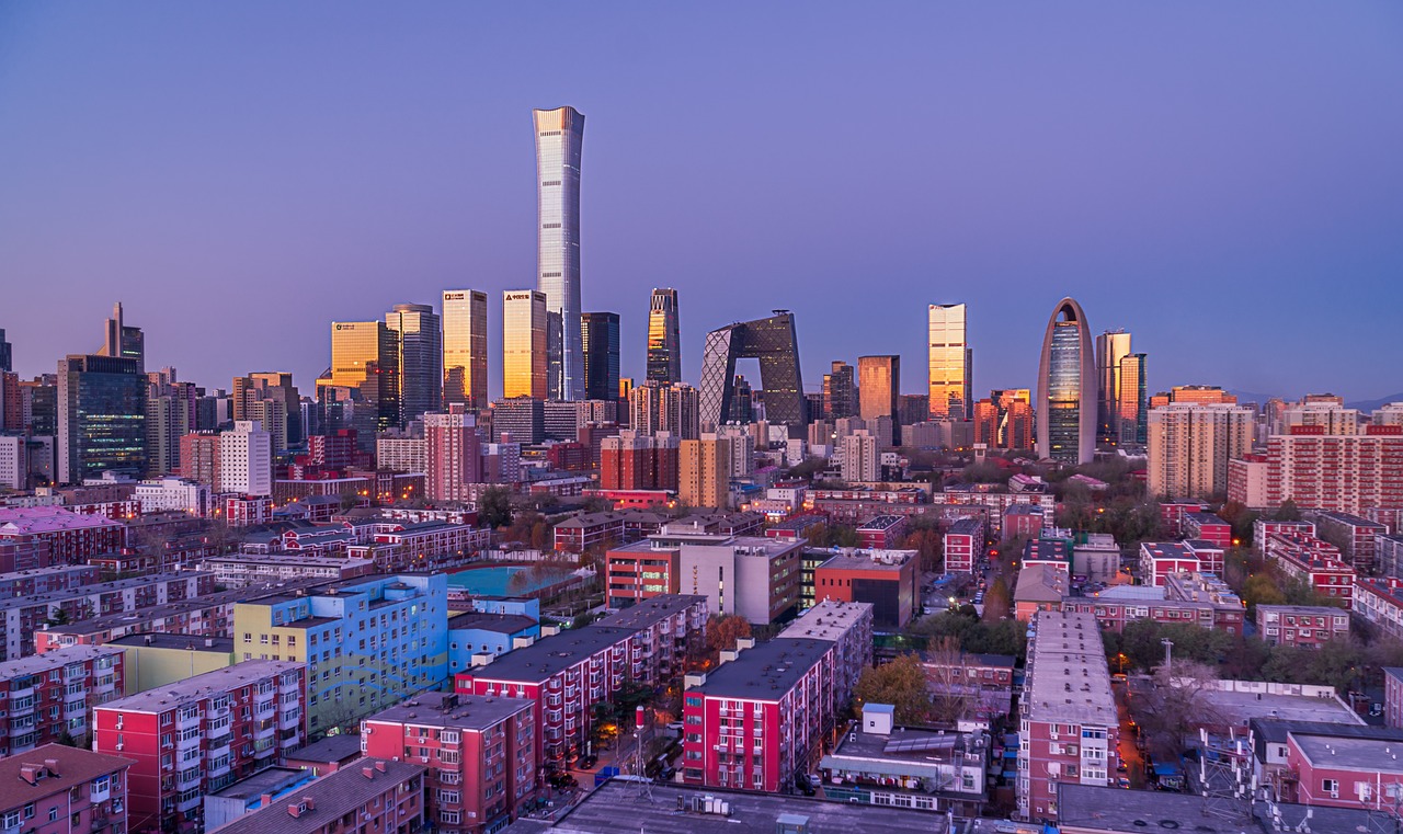A visual contrast between a modern high-rise apartment building and a private residential house.
