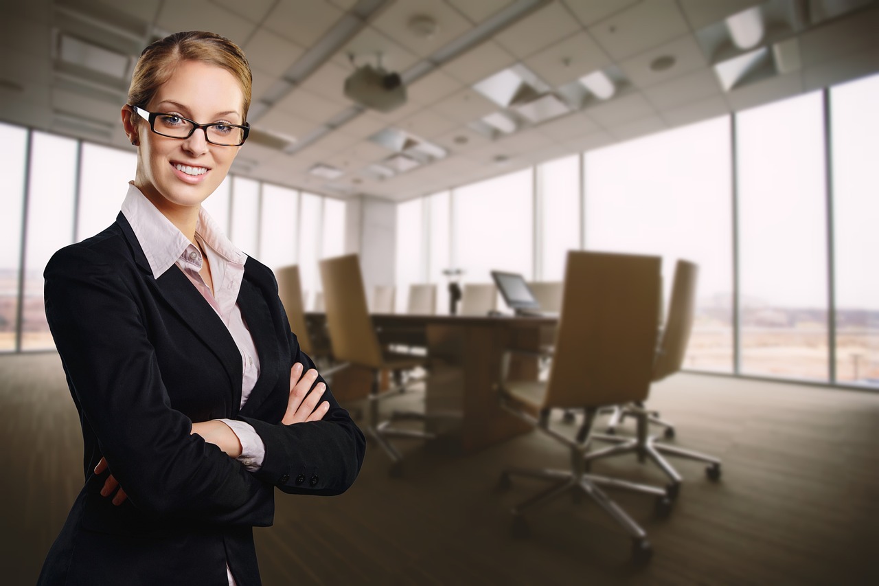 Two professionals in a meeting discussing a claim file in a corporate setting