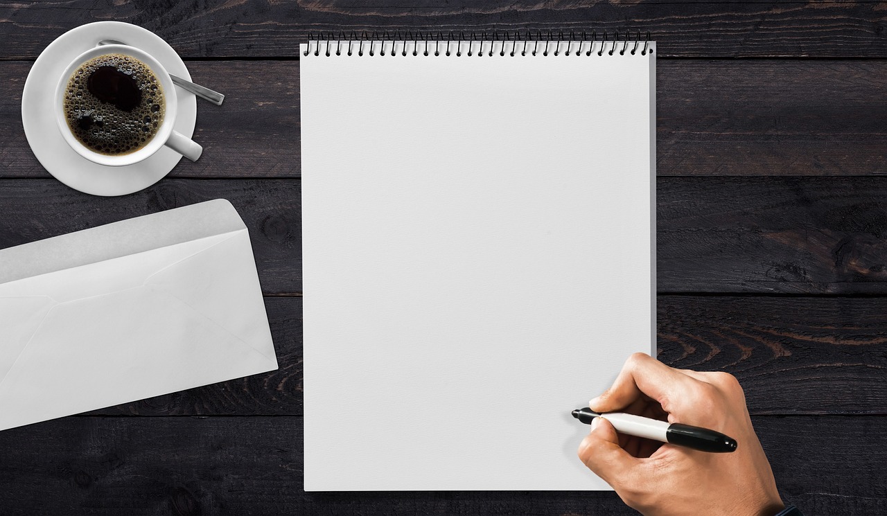 Stacked white envelopes on a desk representing IRS tax notices.