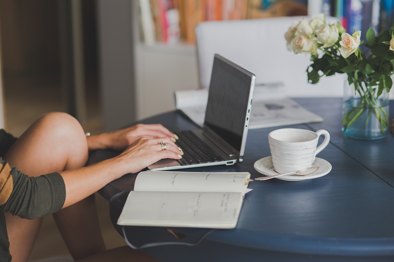 A clean workspace with a laptop and coffee, symbolizing focused financial planning.