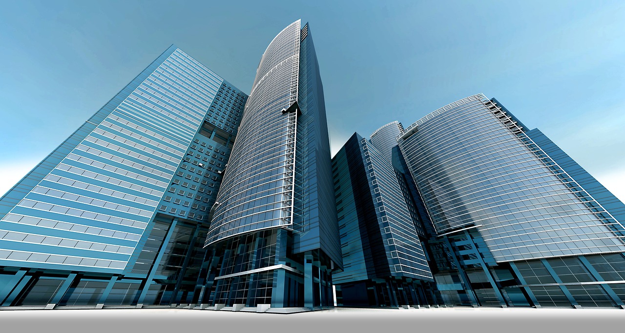 A classic bank building with large columns standing next to a contemporary glass skyscraper.