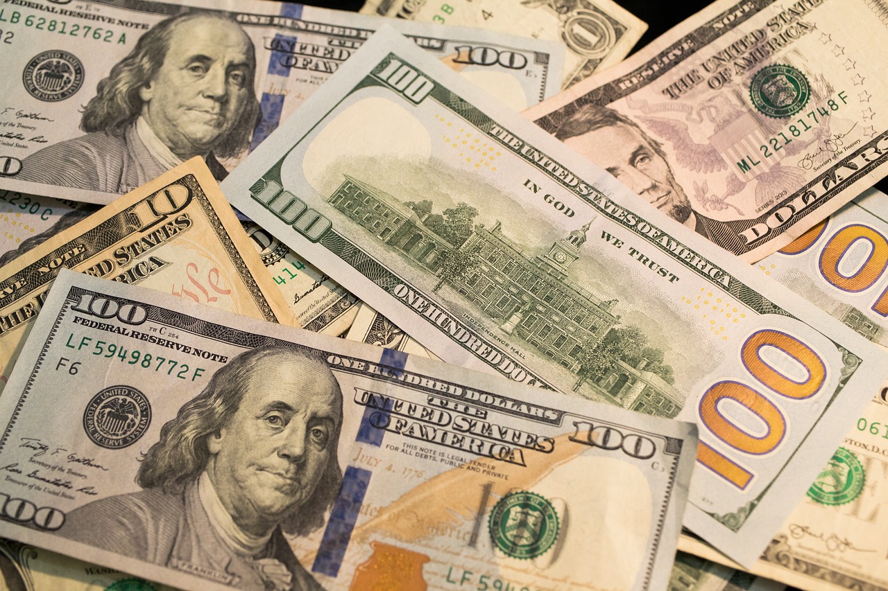 Neatly stacked US hundred dollar bills suggesting high-value savings