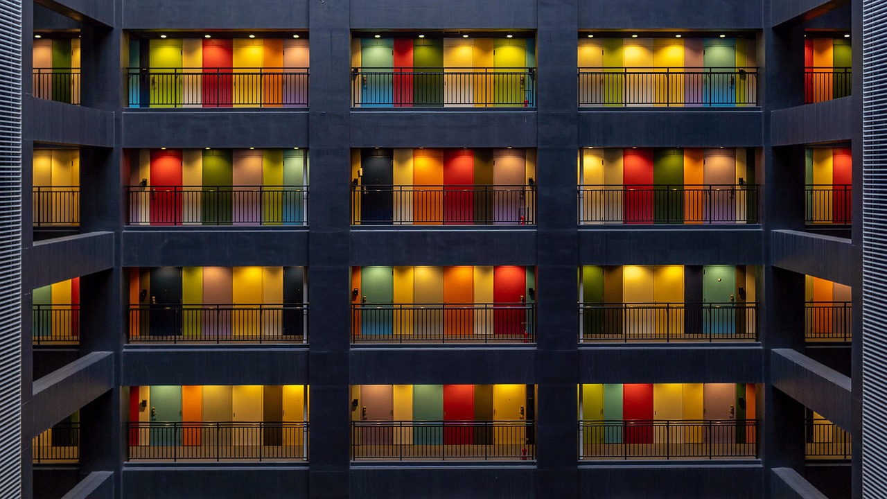A view of a modern apartment complex with multiple units representing diverse landlord types.