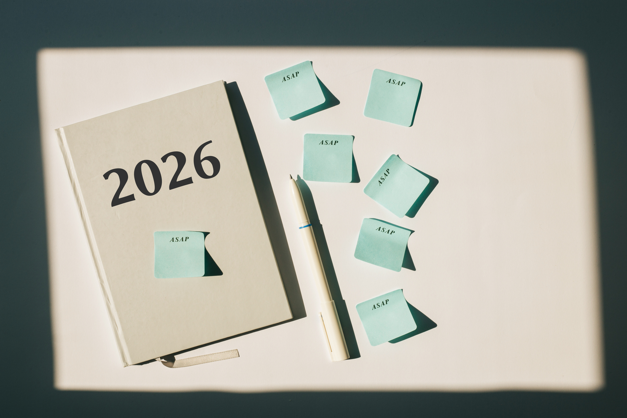A notebook with 2026 written on it and sticky notes saying ASAP.