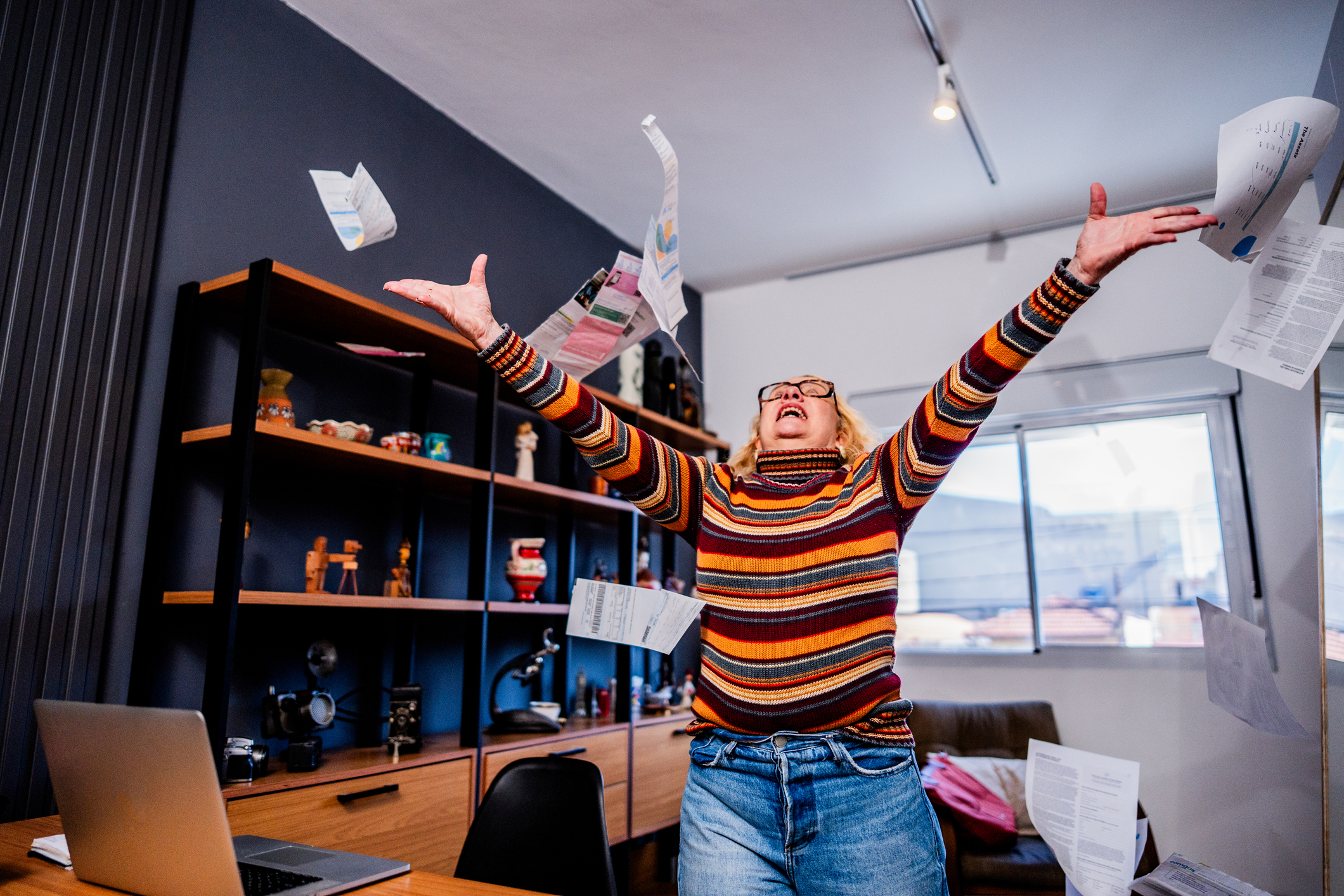 An upbeat woman celebrating a financial win or high earnings.