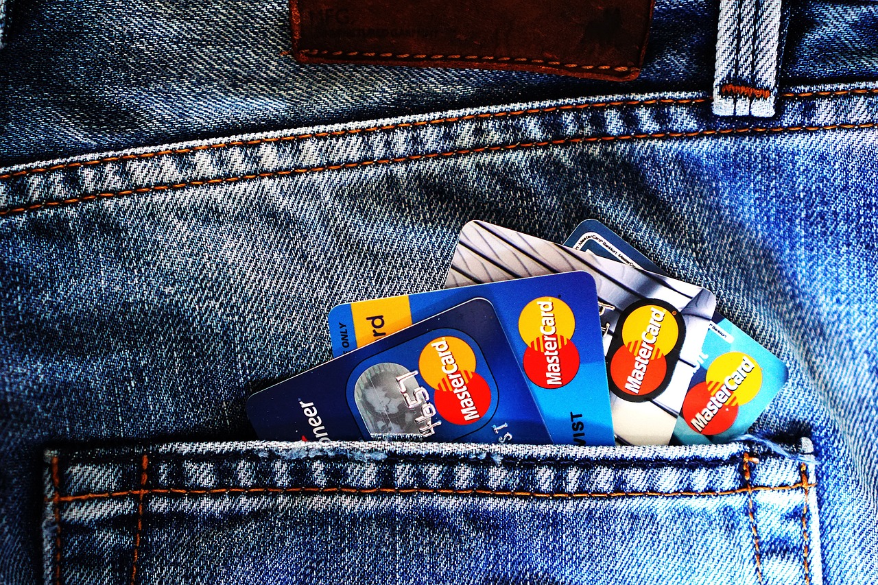 A person using a smartphone to manage a digital wallet with a clean user interface.