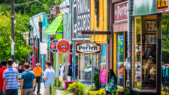 Pedestrians walking through a historic, renovated commercial district in Omaha.