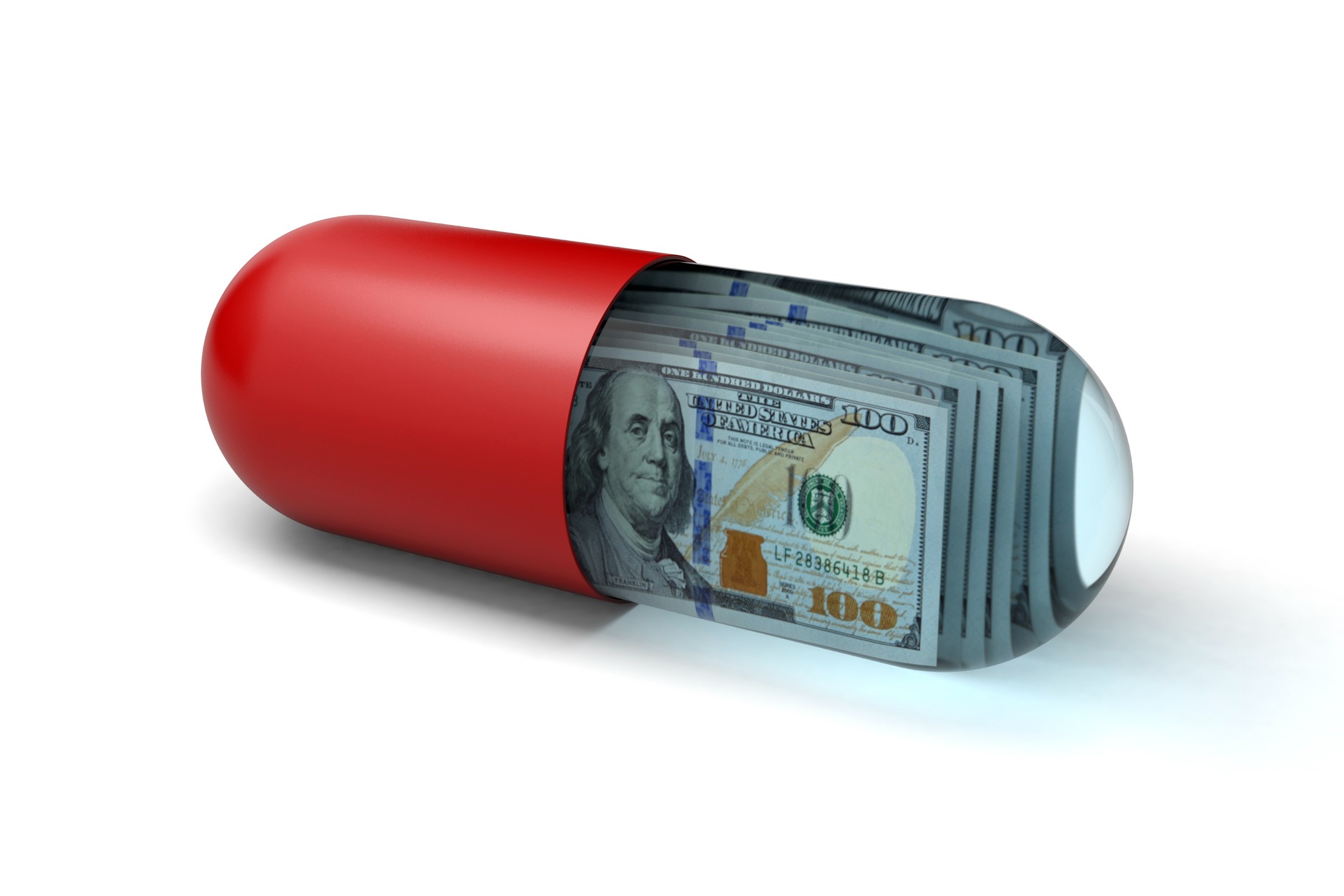 Concept image of a medicinal capsule filled with hundred-dollar bills.