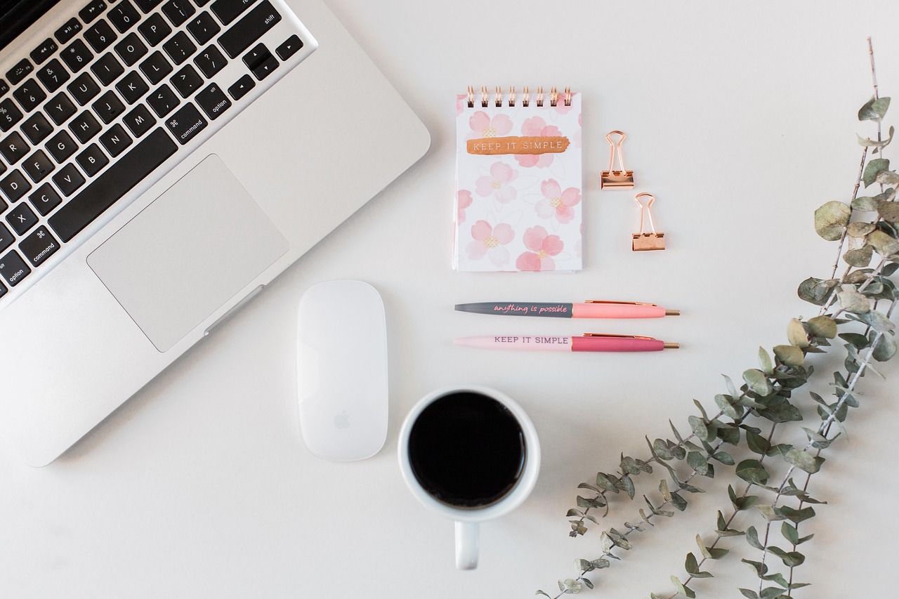 An organized workspace with a notepad and pen, representing clarity and answers.