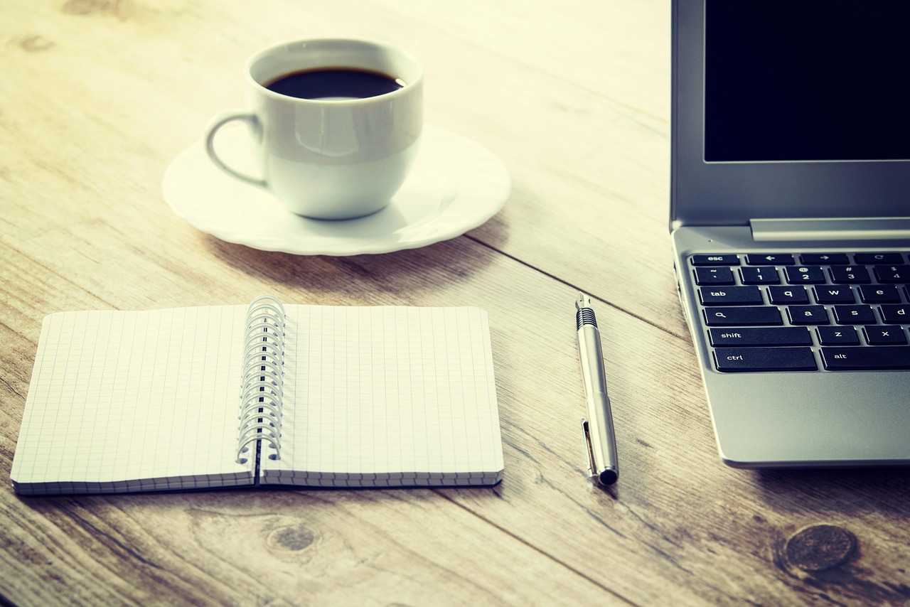 A comfortable home office setup showing a laptop screen used for online banking.