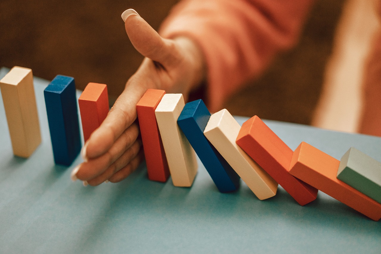 Neatly arranged wooden blocks representing different savings goals or buckets.