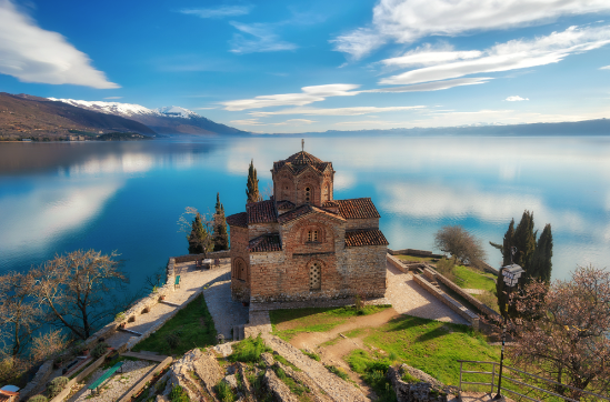 The Church of St. John at Kaneo overlooking the blue waters of Lake Ohrid.