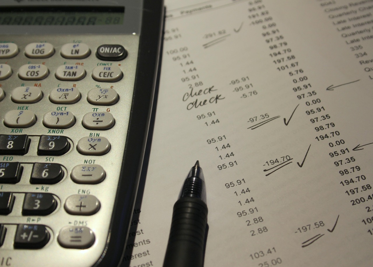 A magnifying glass focusing on specific numerical codes on a billing statement.