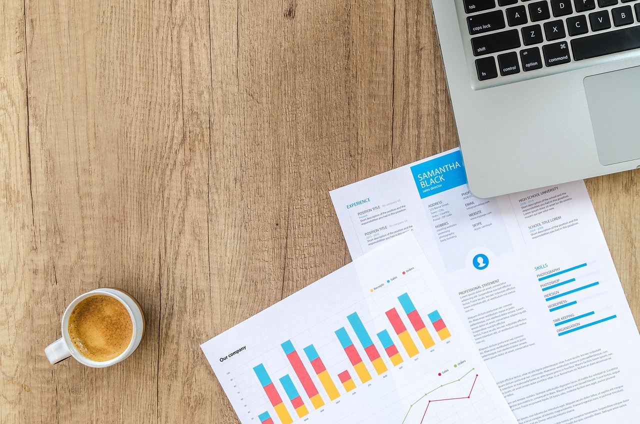 A professional couple reviewing papers with a financial planner